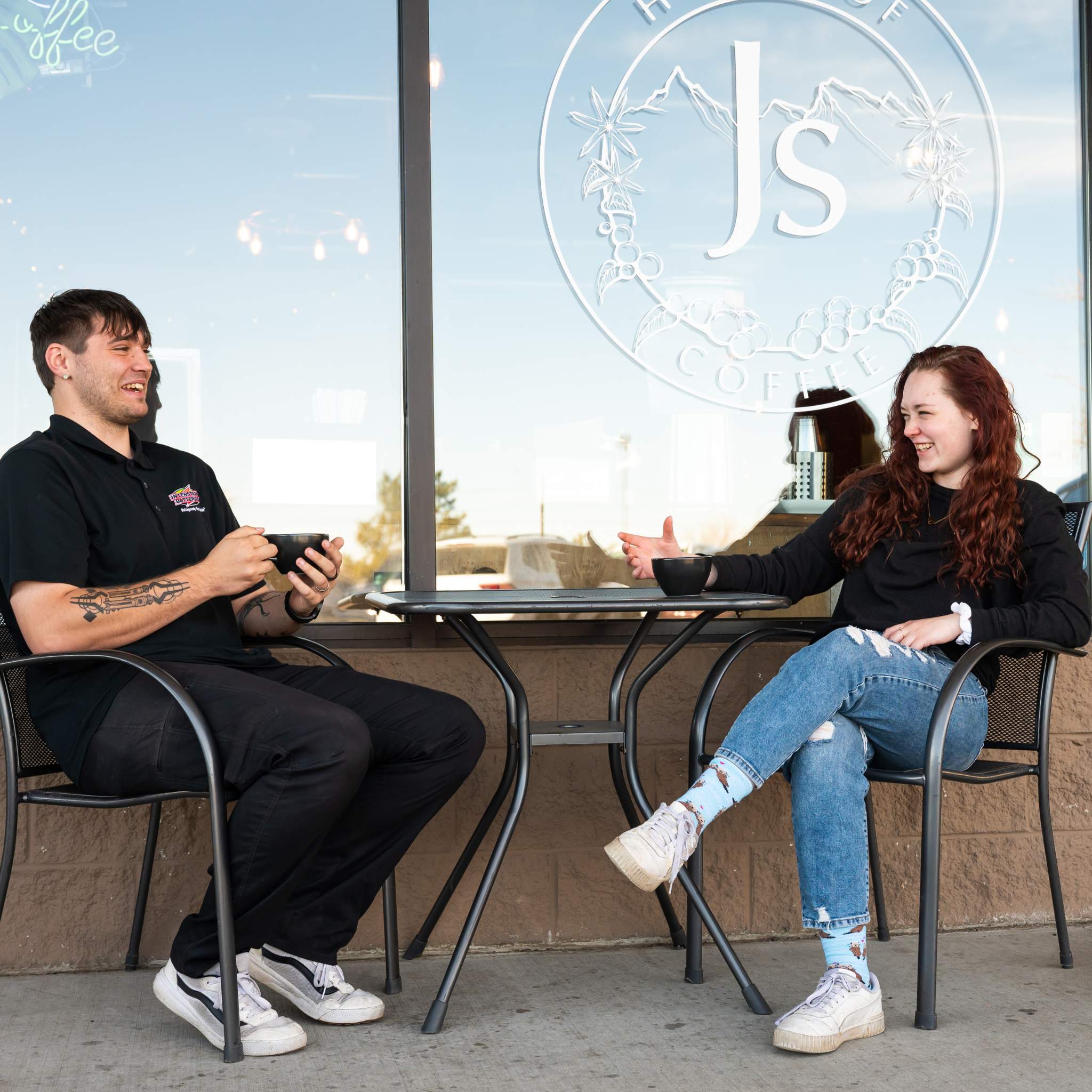 Customers enjoying their coffee outside the shop