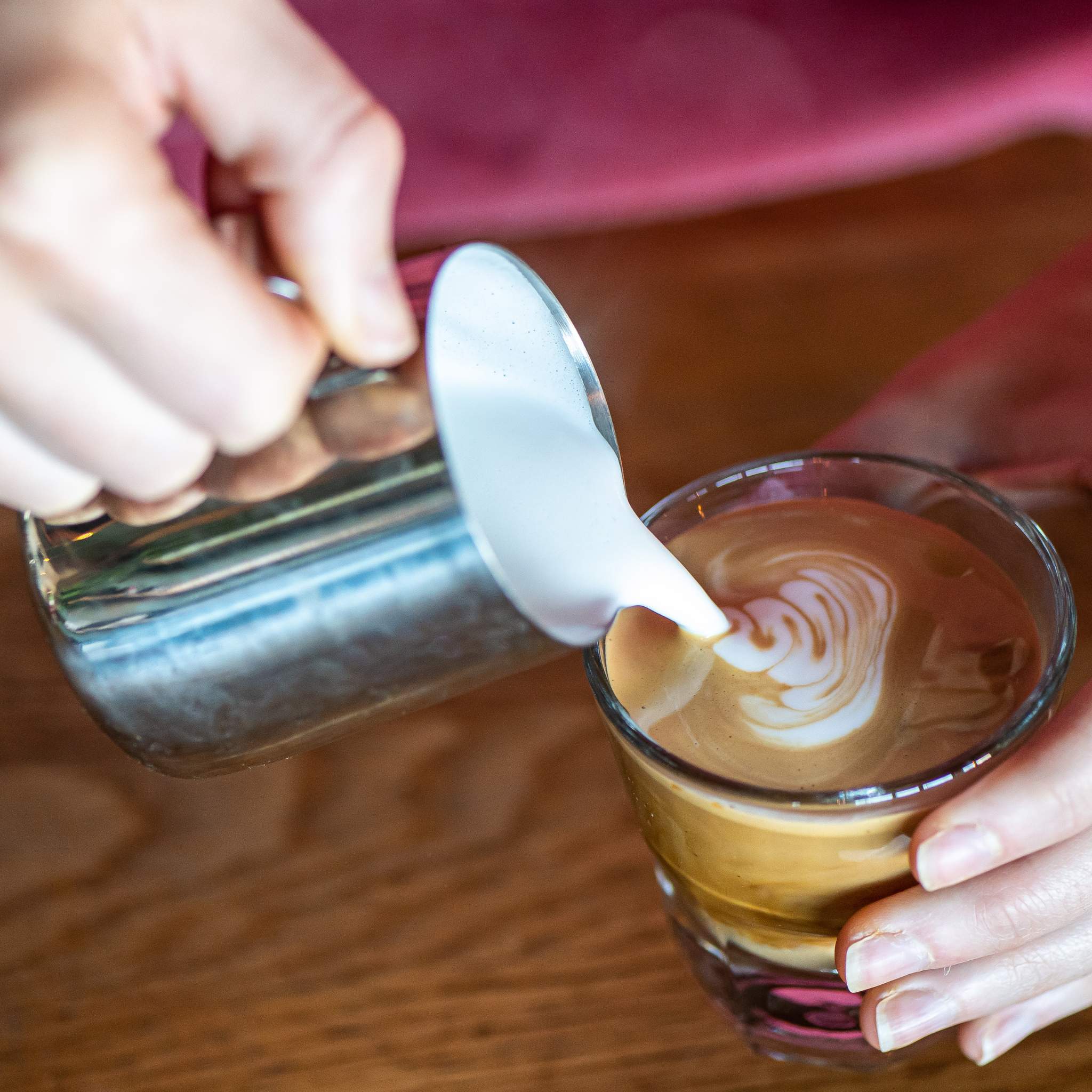 Barista performing latte art